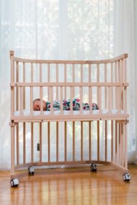 Baby in bedside sleeper | babybay bedside co-sleepers