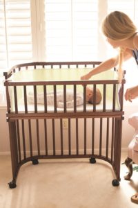 Mother and baby in bassinet crib | babybay bedside sleepers