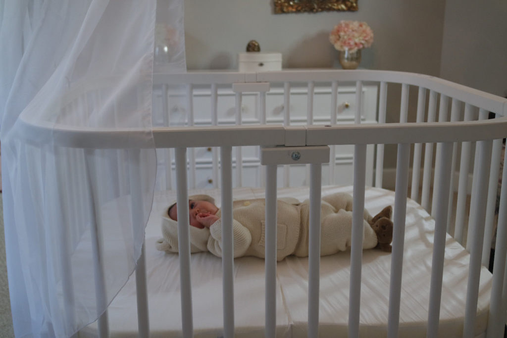 Baby in a bedside bassinet | babybay bedside sleepers