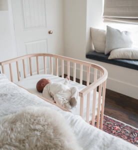 A baby in a co sleeper, an alternative to a wood crib | babybay co-sleepers