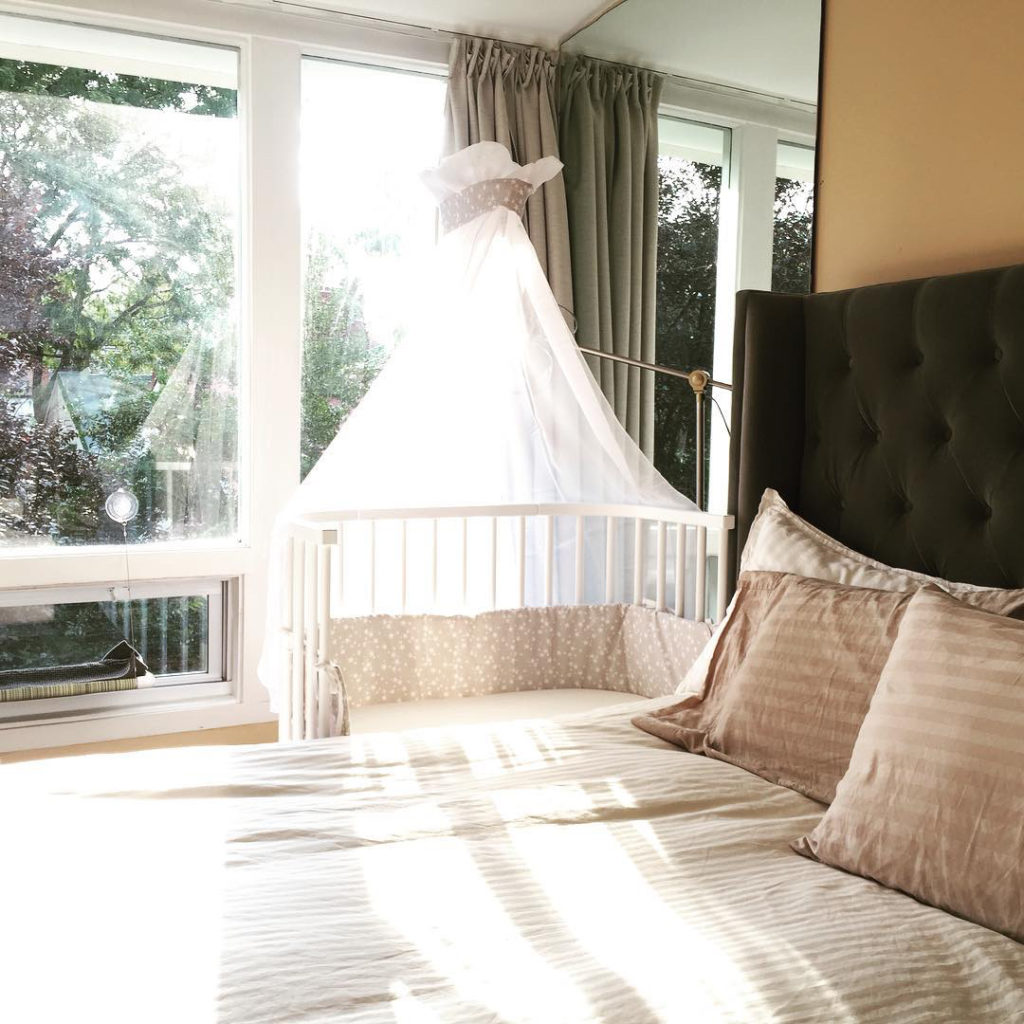 A bedside co-sleeper in a bedroom | babybay Bedside Bassinets