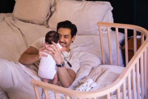 Newborn baby with father snuggling | babybay cosleeper cribs
