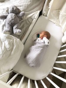 Baby sleeping while parent work on transitioning from co-sleeping | babybay cosleeper crib