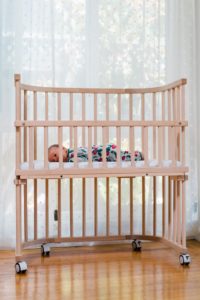 Baby napping comfortably in a bedside sleeper | babybay bedside co-sleeper