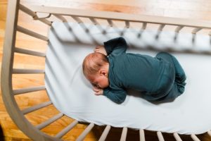 Baby sleeping in co-sleeper after parents learning about crib safety standards | babybay Bedside Co-Sleeper