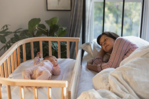 Mother and baby co sleeping together | babybay cosleepers