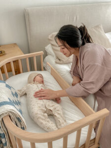 Parent with baby fighting sleep | babybay bedside sleepers